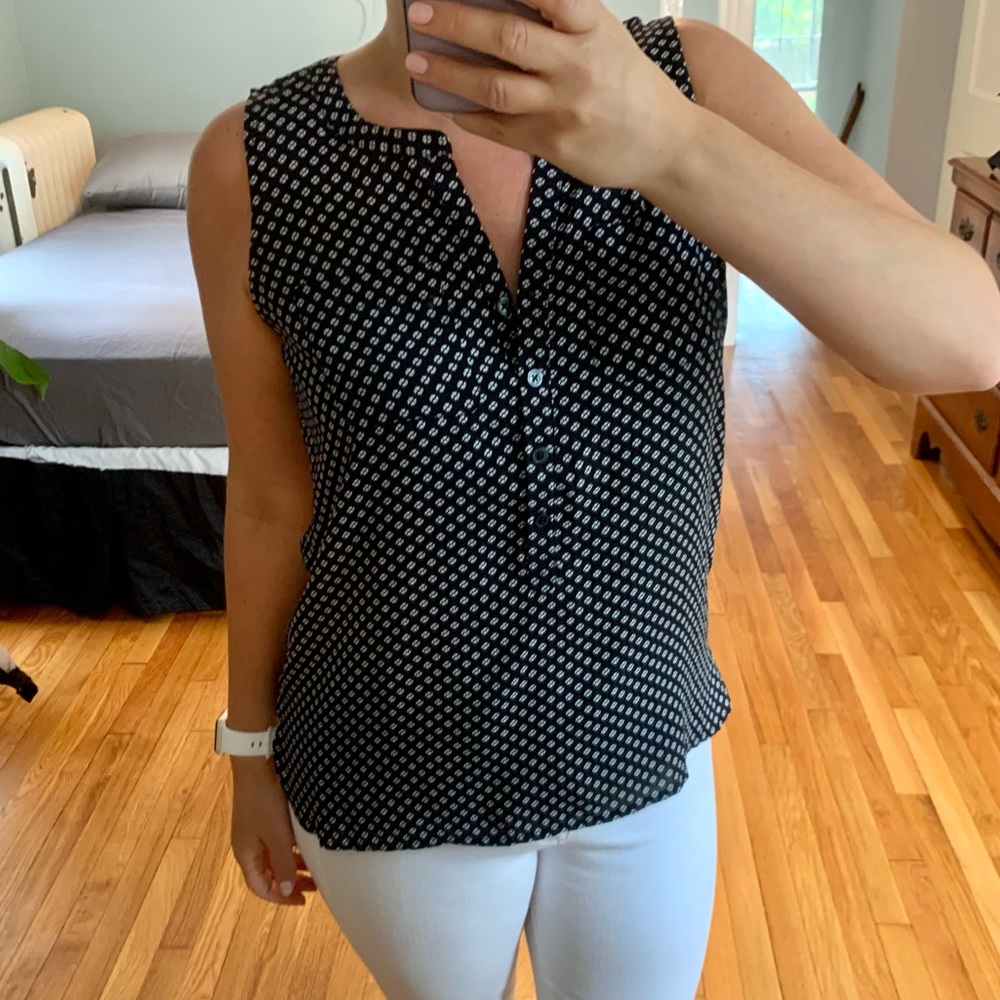 Navy blue sleeveless blouse with white flower pattern